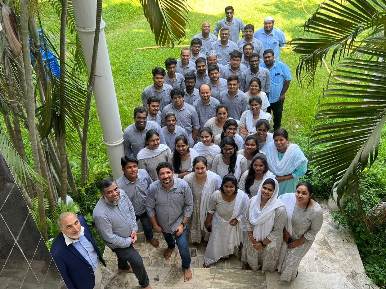 The Rayan Architects studio photographed from above in the garden, in grey studio shirts